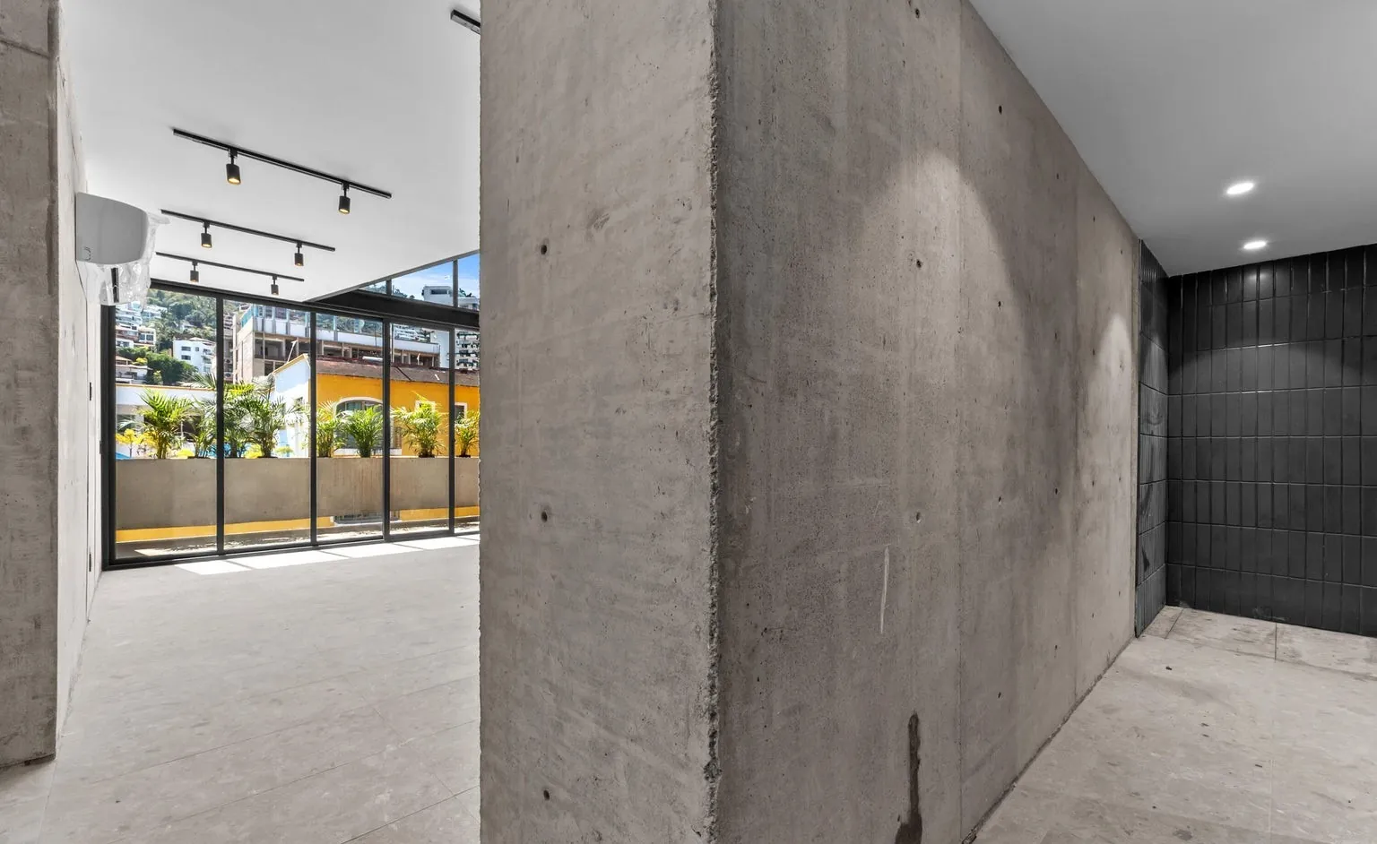 Concrete interior open to glass