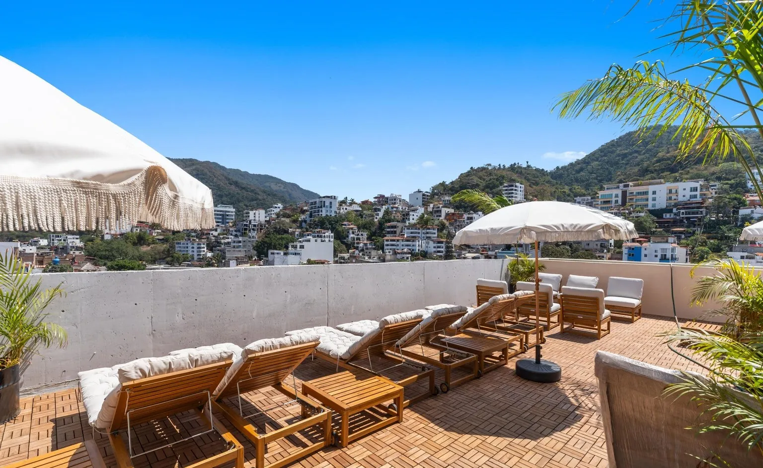 Rooftop lounge chairs with mountain view