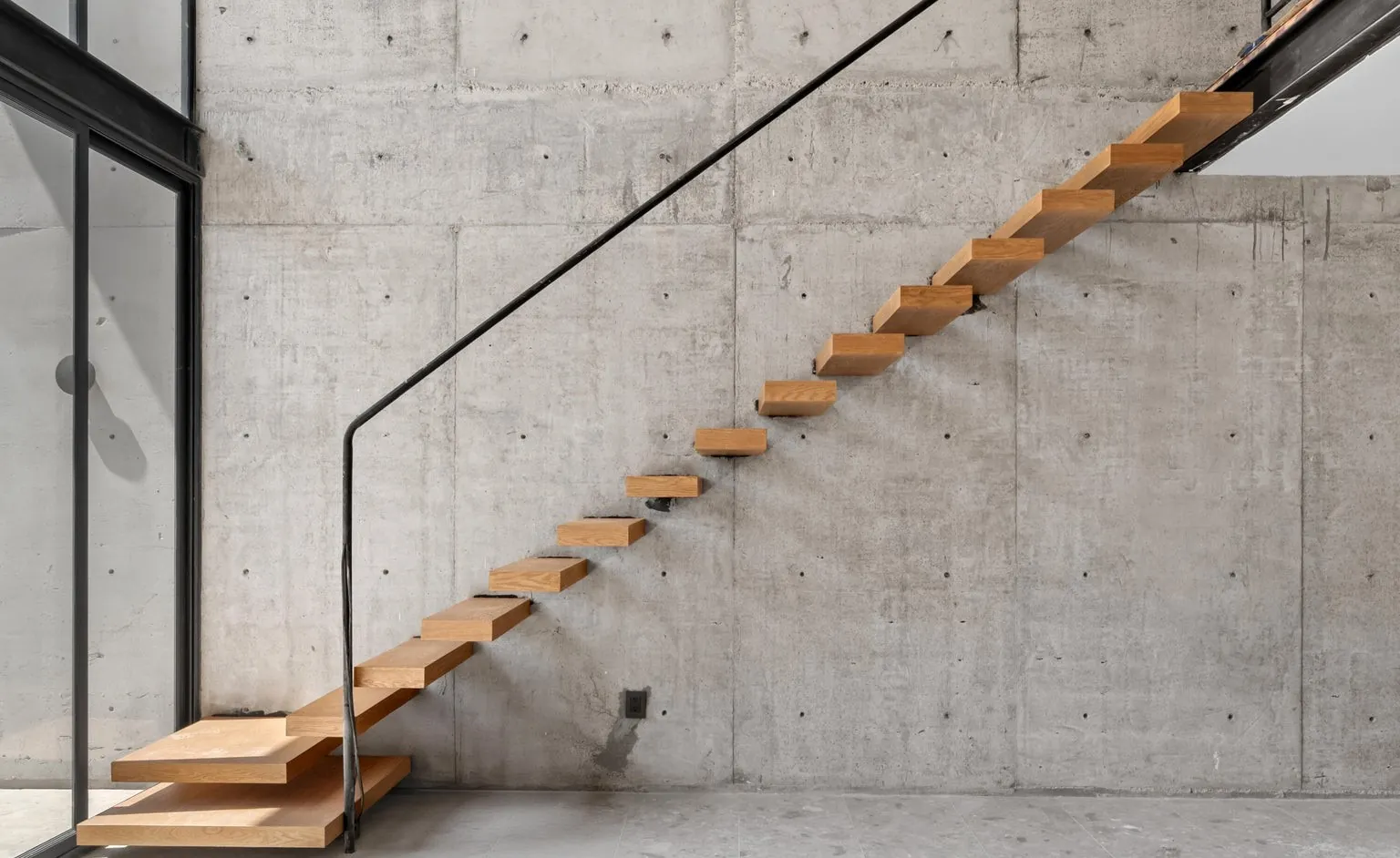 Floating stair against concrete