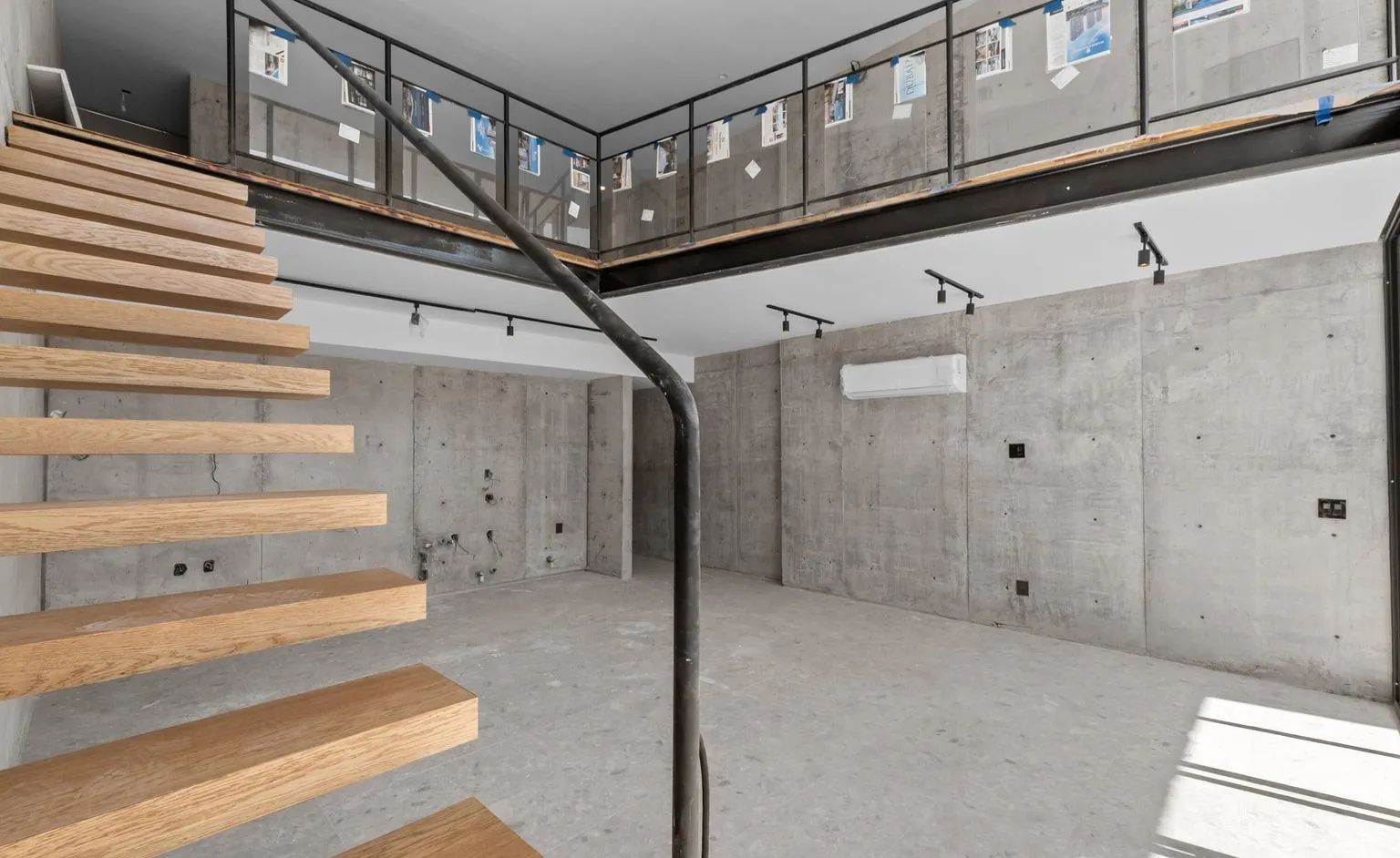 Sculptural floating staircase in wood and steel
